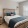 Bedroom with natural lighting and high ceilings