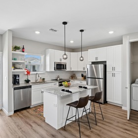open kitchen next to laundry closet